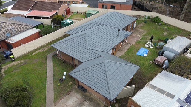 After: roof restoration. Red tiles that had lost their colour, finished in charcoal grey.