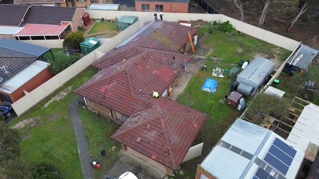 Before: roof restoration. Red tiles that had lost their colour, finished in charcoal grey.