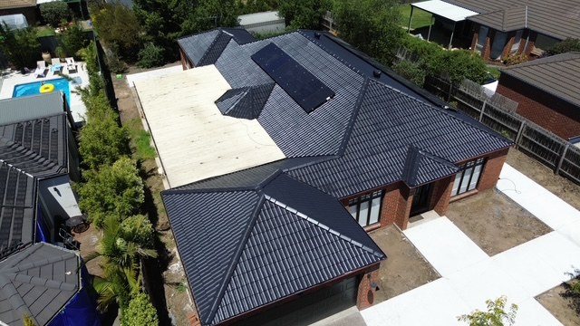 After: roof restoration. Faded sections brought back to an even charcoal.