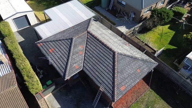 Before: roof restoration. Repointed first, then coated charcoal.