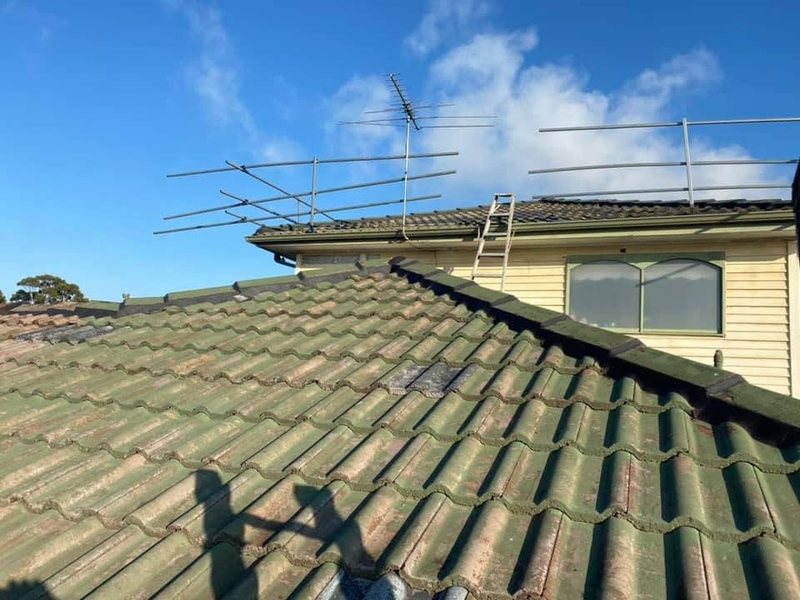 Before: roof restoration. Up close: mossy green tiles to a gloss charcoal finish.