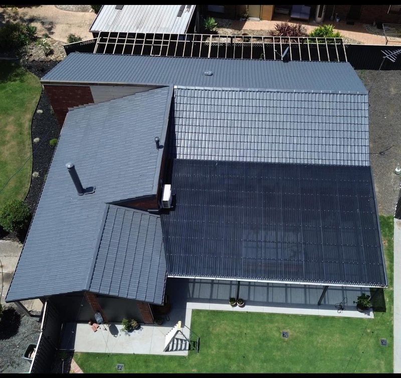 After: roof restoration. A two-tone roof brought back to one even charcoal.