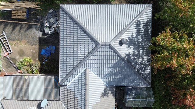 After: new roof. From bare frame and sarking to a finished tiled roof.