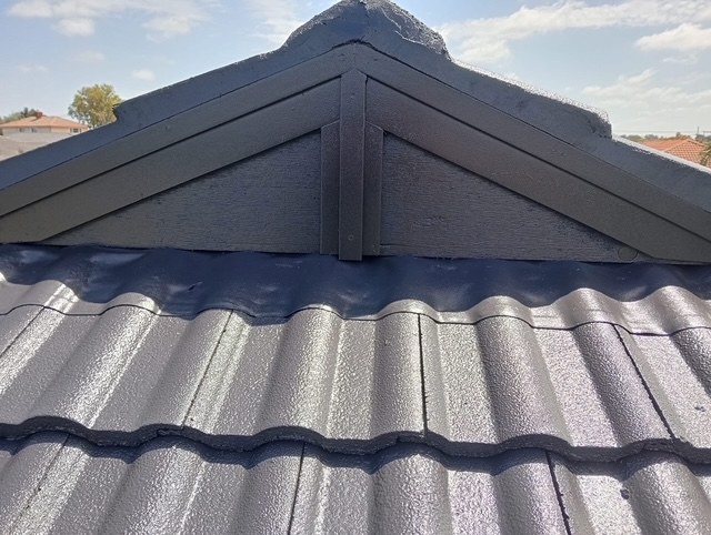 After: ridge rebedding and repointing. Broken ridge capping rebedded and repointed.