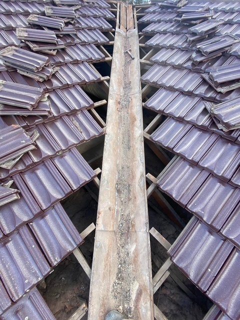 Before: valley replacement. A rusted valley iron replaced.